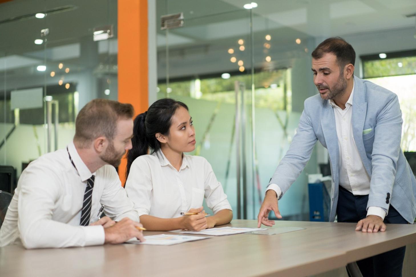 Financial analysts reviewing data models and forecasts